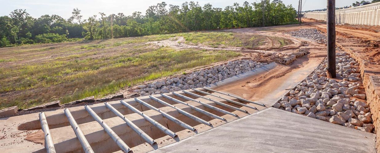 drainage tunels and rocks next to SH 249 Tomball Tollway